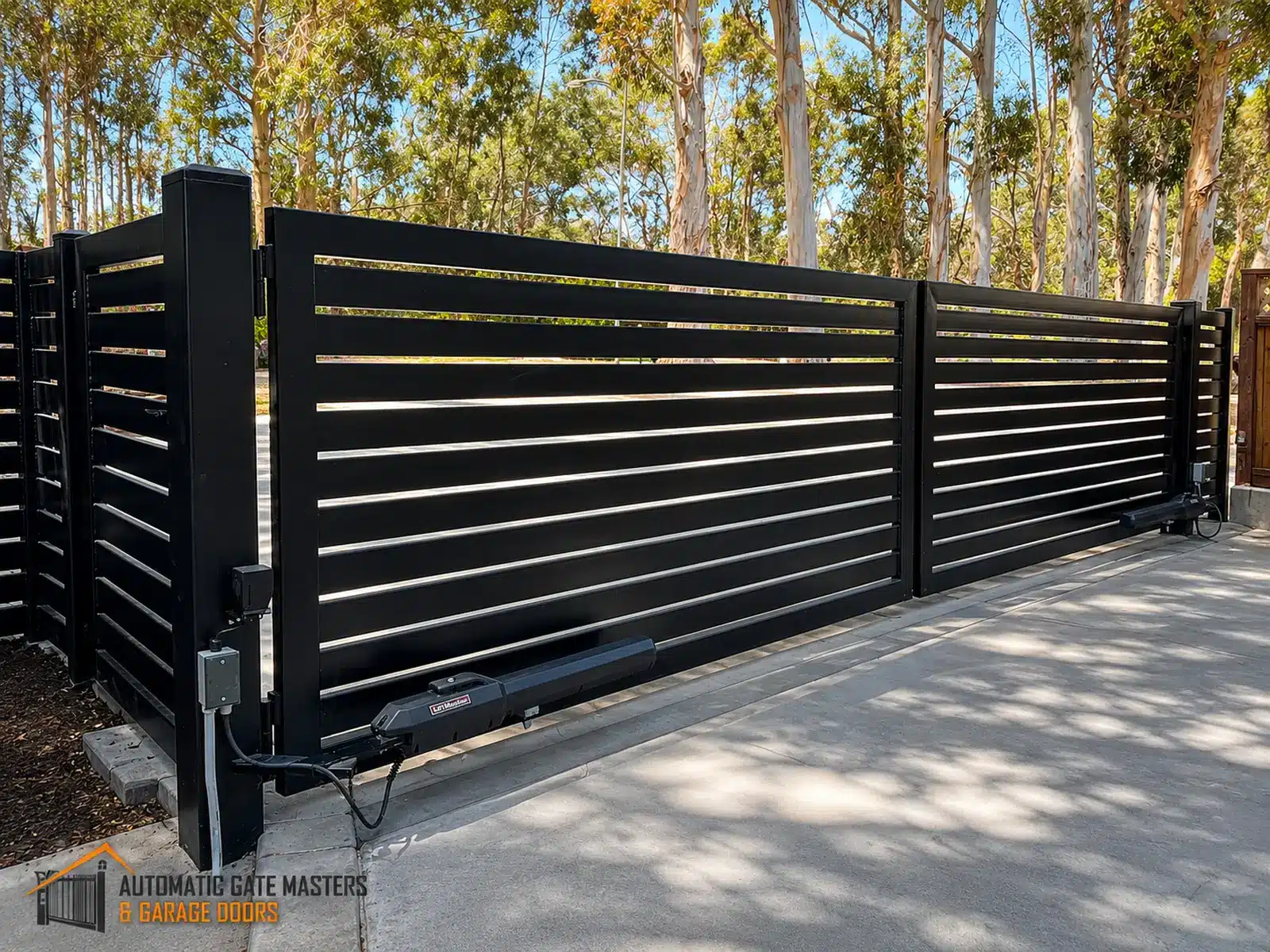 Modern black horizontal slat dual swing driveway gate built by Automatic Gate Masters